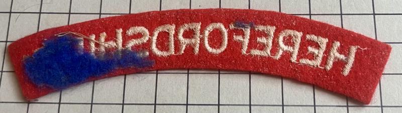 c1943 WW2 Herefordshire Regiment Paste Back Cloth Shoulder Title Badge