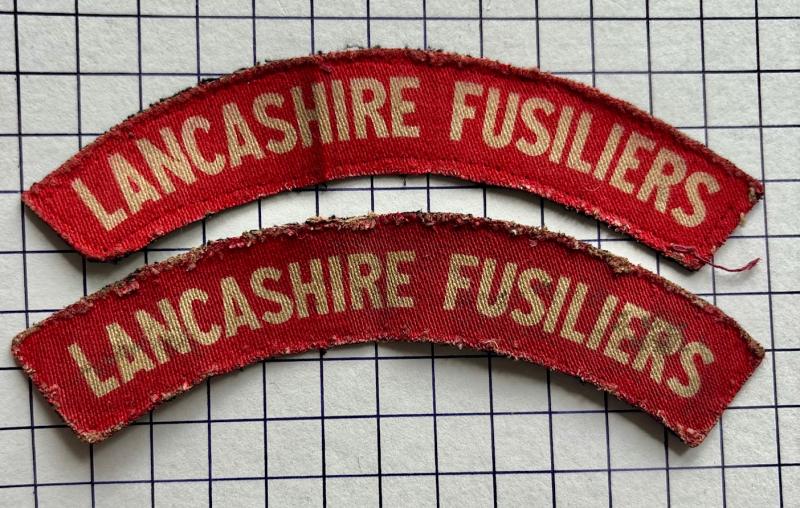 cWW2 Printed Lancashire Fusiliers Regiment Pair Printed Cloth Shoulder Title Badges