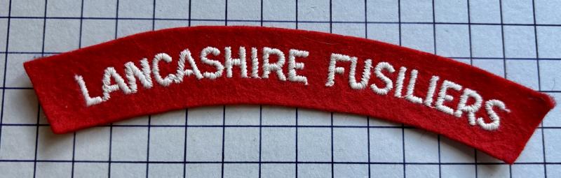 cWW2 Lancashire Fusiliers Paste Backed Cloth Shoulder Title